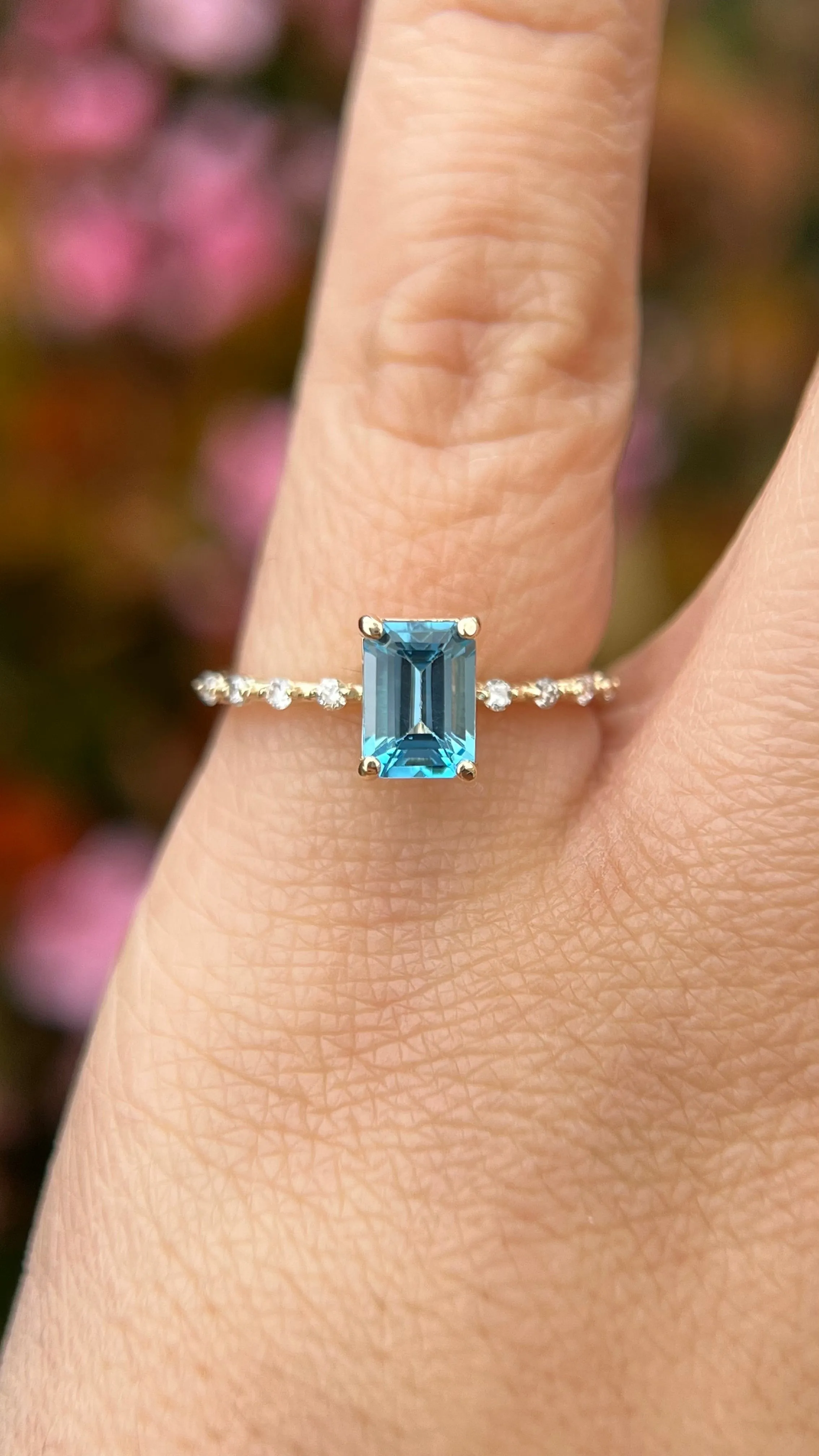 Bella 7x5mm 0.70ct Emerald Cut Blue Topaz Spaced Diamond Ring 14K Gold DFR035